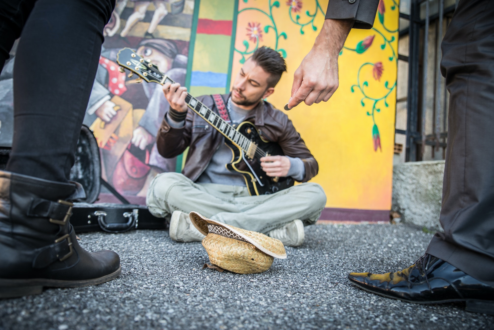 Street artist playing guitar on the streets