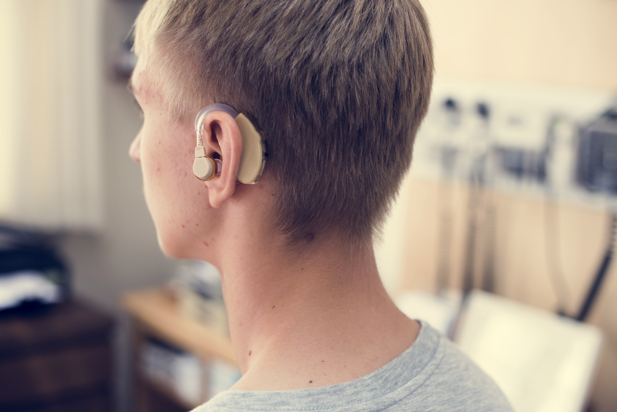 Young man with hearing aid